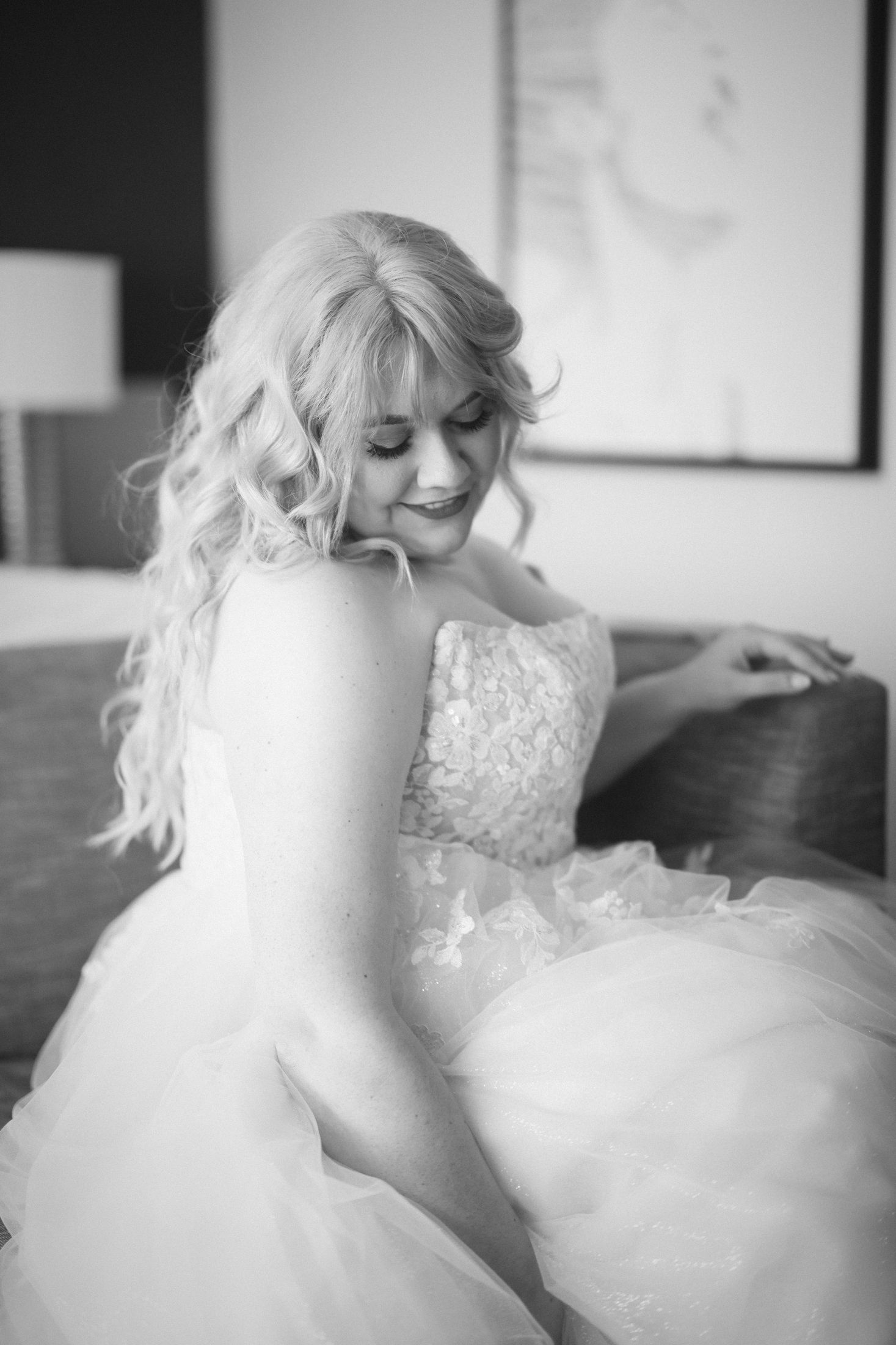 Black and white portrait of a bride looking down over her shoulder