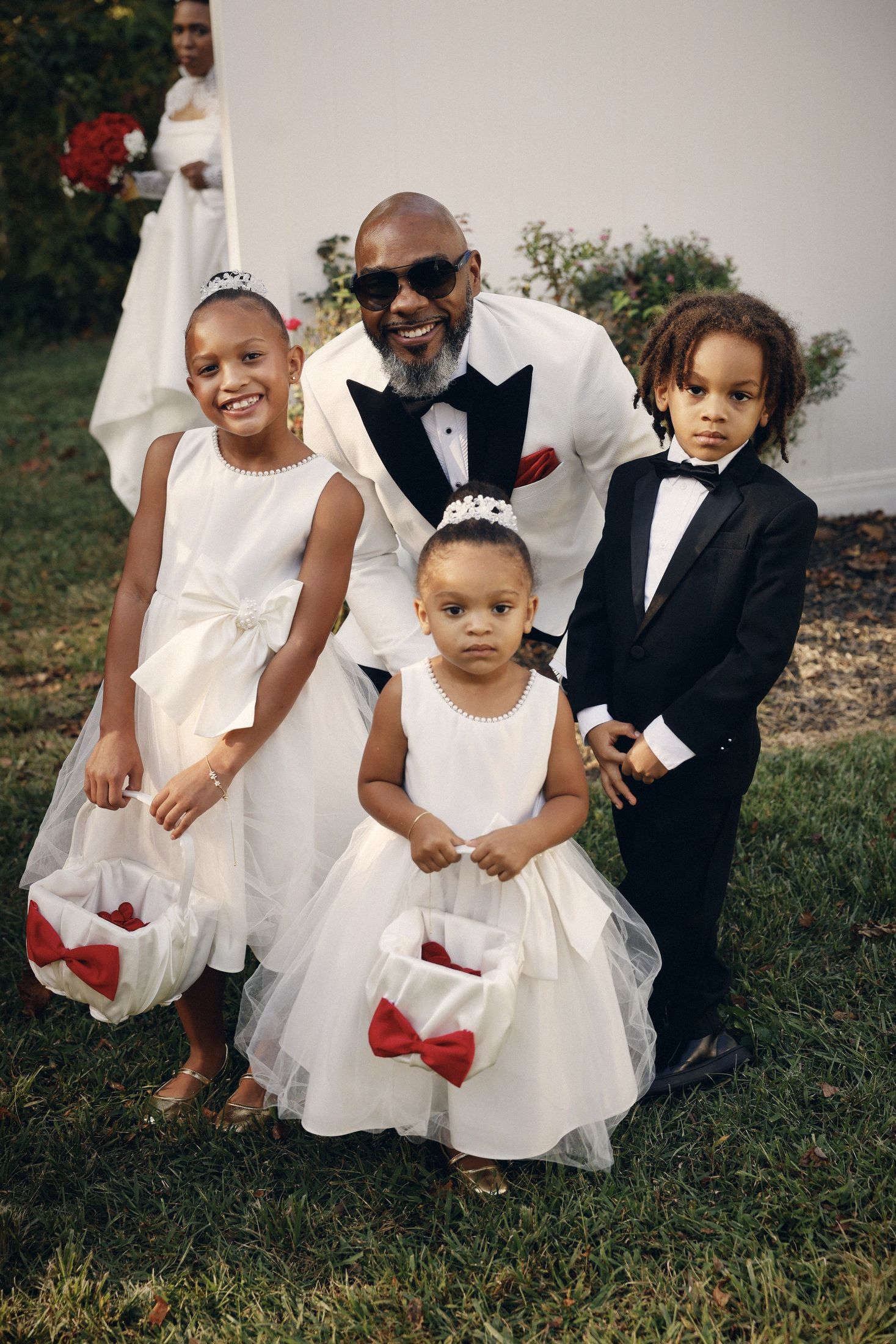 Groom with the flower girls and ring bearer