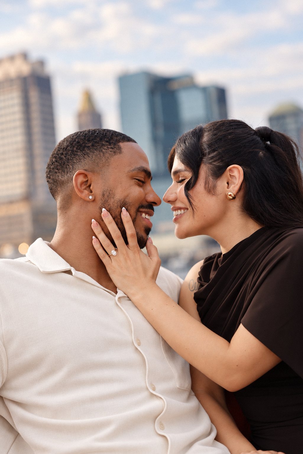 Close up of the couple touching noses against the skyline