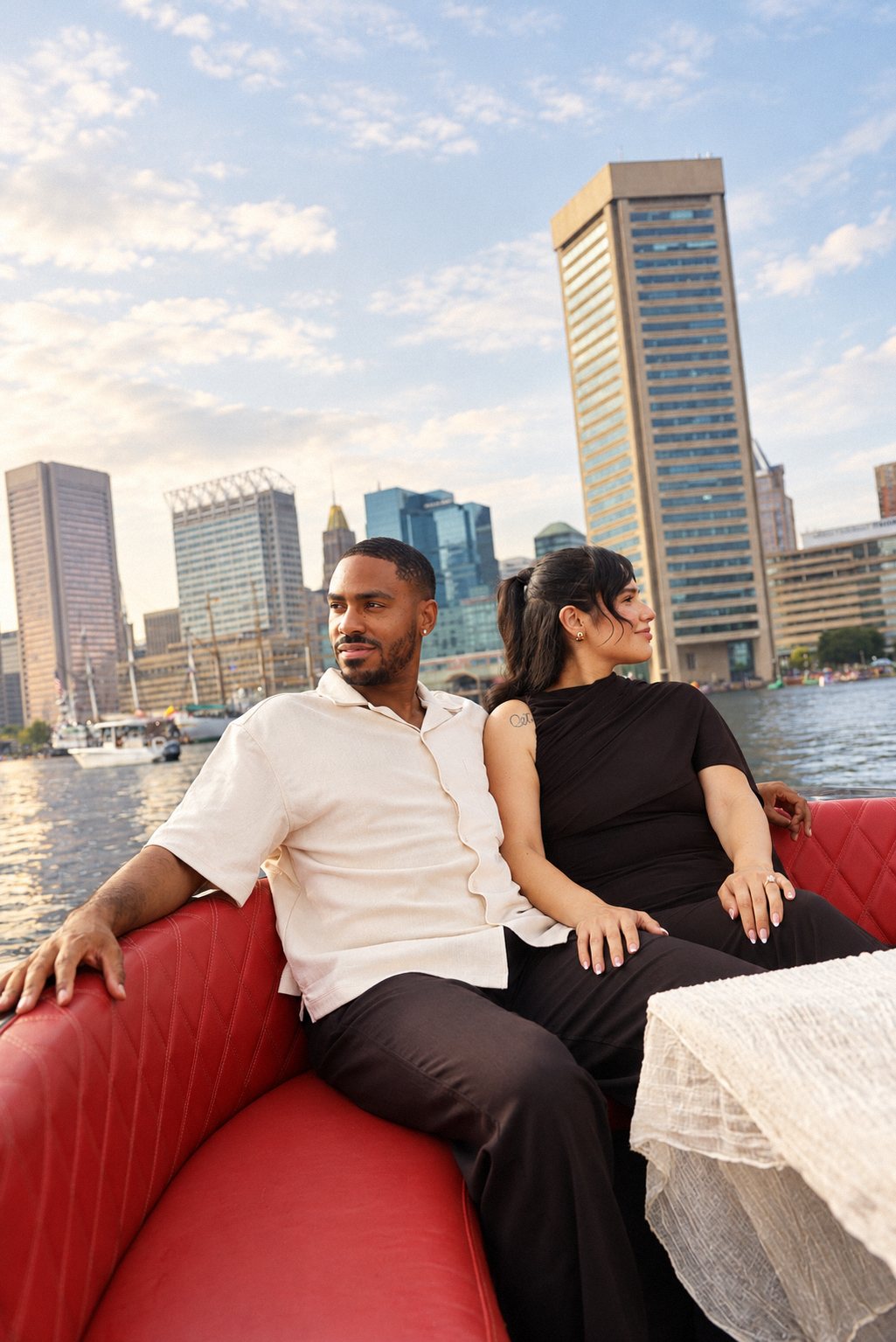 Couple looking out over the harbor toward the World Trade Center